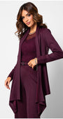 Woman wearing a burgundy dress with matching coat on a white background