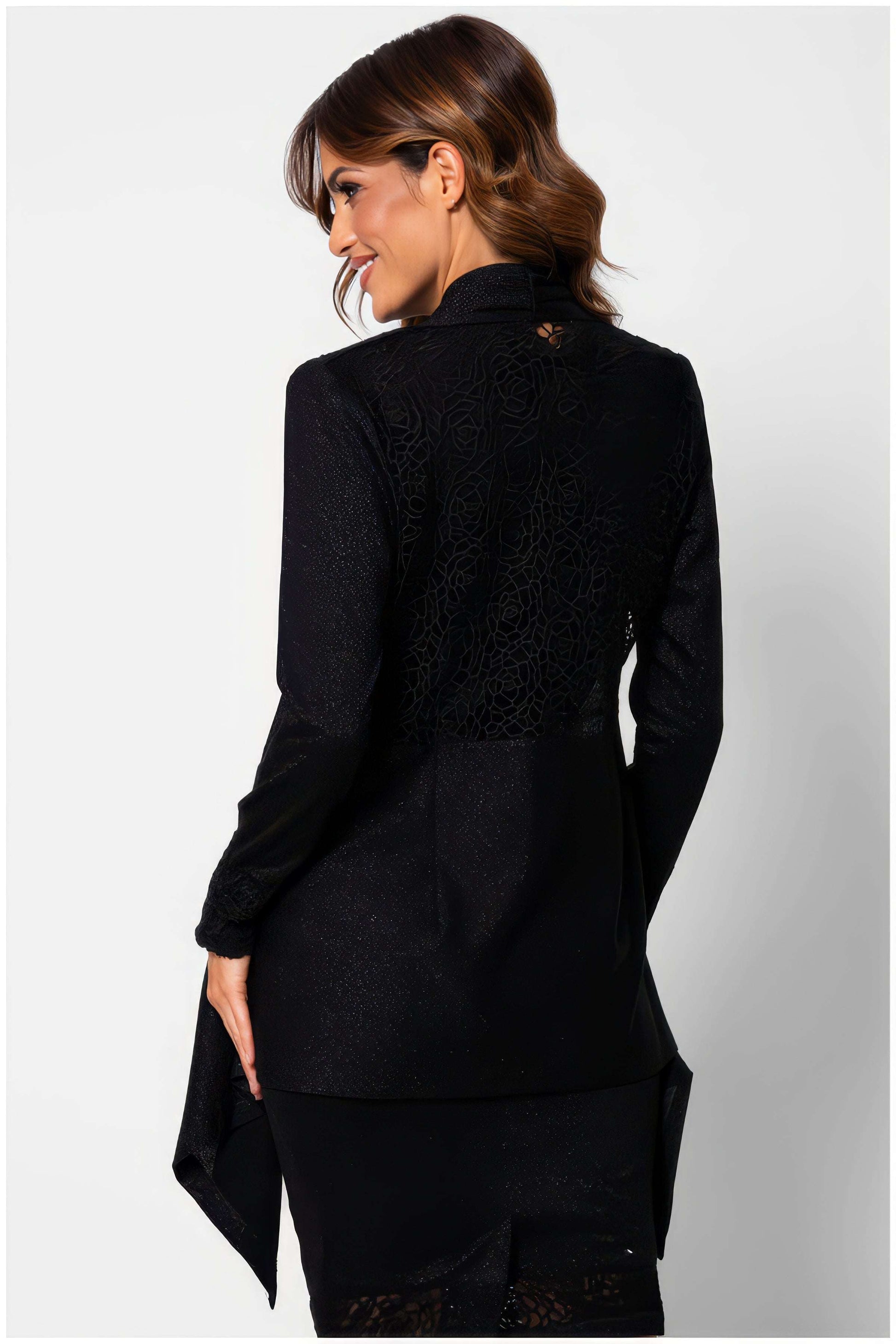 Woman wearing Jody Lace Cardigan in Black by Luna Fashion House showcasing elegant lace detail on the back and long sleeves