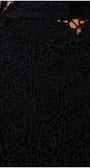 Close-up of black lace cardigan detailing on the back of the Cardigan Jody, showcasing intricate floral patterns.