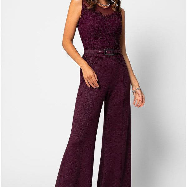 Woman wearing elegant Bordeaux lace Lace Overalls with wide-leg trousers and tonal belt, smiling against white background
