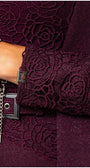 Close-up of bordeaux lace cardigan Jody lace cuff detail and silver chain bracelet on wrist by Luna Fashion House.