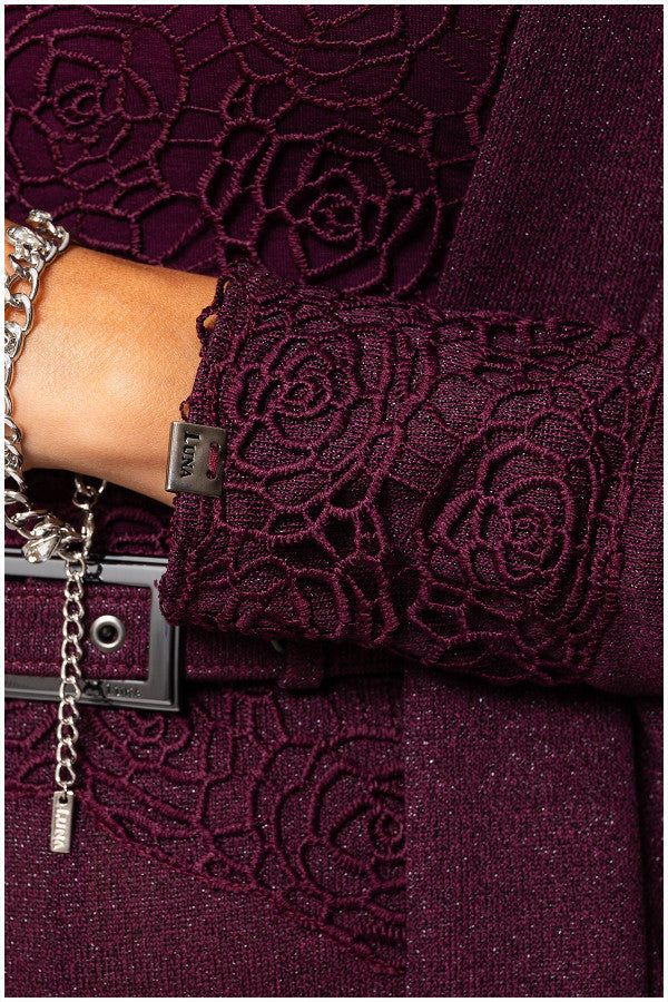 Close-up of bordeaux lace cardigan Jody lace cuff detail and silver chain bracelet on wrist by Luna Fashion House.