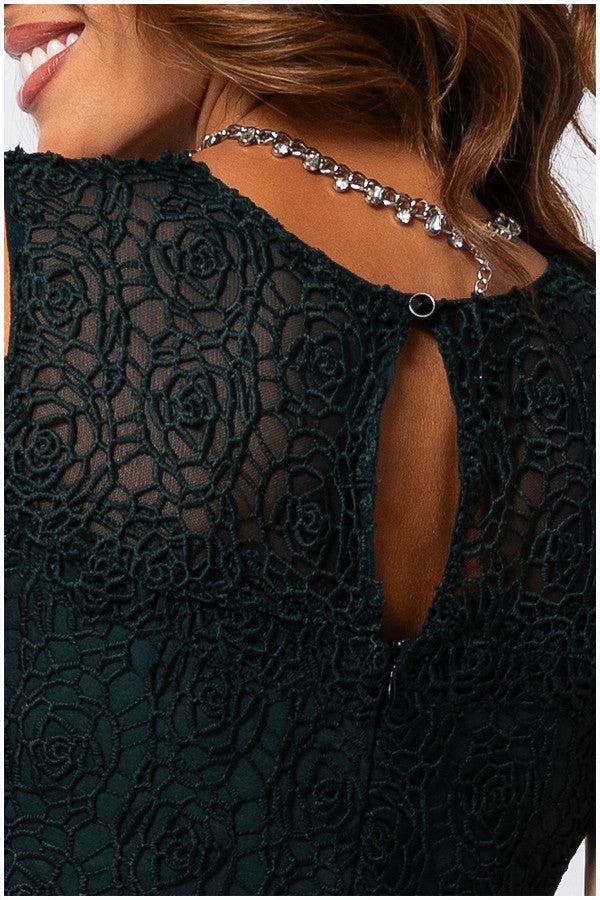 Close-up of Lace Overalls bodice detail with floral pattern and keyhole back in midnight green Overall Jody jumpsuit