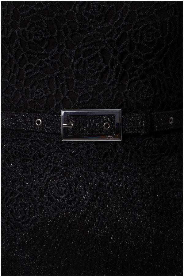 Close-up of black lace Lace Overalls with floral pattern and a shimmering tonal belt with rectangular buckle on Overall Jody jumpsuit.