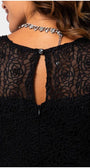 Close-up of the black Lace Overalls with sheer floral detailing and button closure on the OVERALL JODY jumpsuit back.