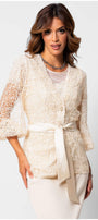 Elegant woman wearing Jody Lace Belted Sweater in Ivory with detailed floral lace and satin waist tie from Luna Fashion House