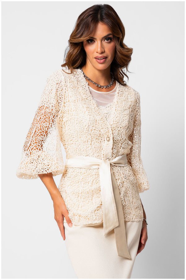 Woman wearing ivory lace cardigan Sweater Jody with semi-sheer sleeves and belted waist.