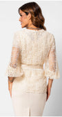 Back view of a woman wearing Jody Lace Belted Sweater in Ivory with intricate lace design and flared sleeves.