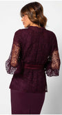 Rear view of a model wearing the Jody Lace Belted Sweater in Bordeaux with intricate lace and satin belt detailing