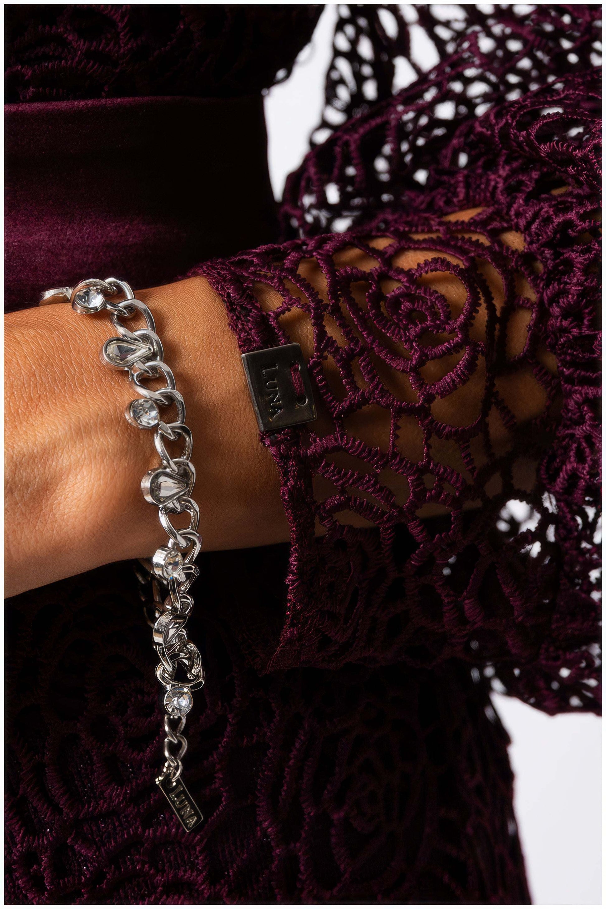 Close-up of intricate lace sleeve detail on Jody Lace Belted Sweater in Bordeaux from Luna Fashion House collection