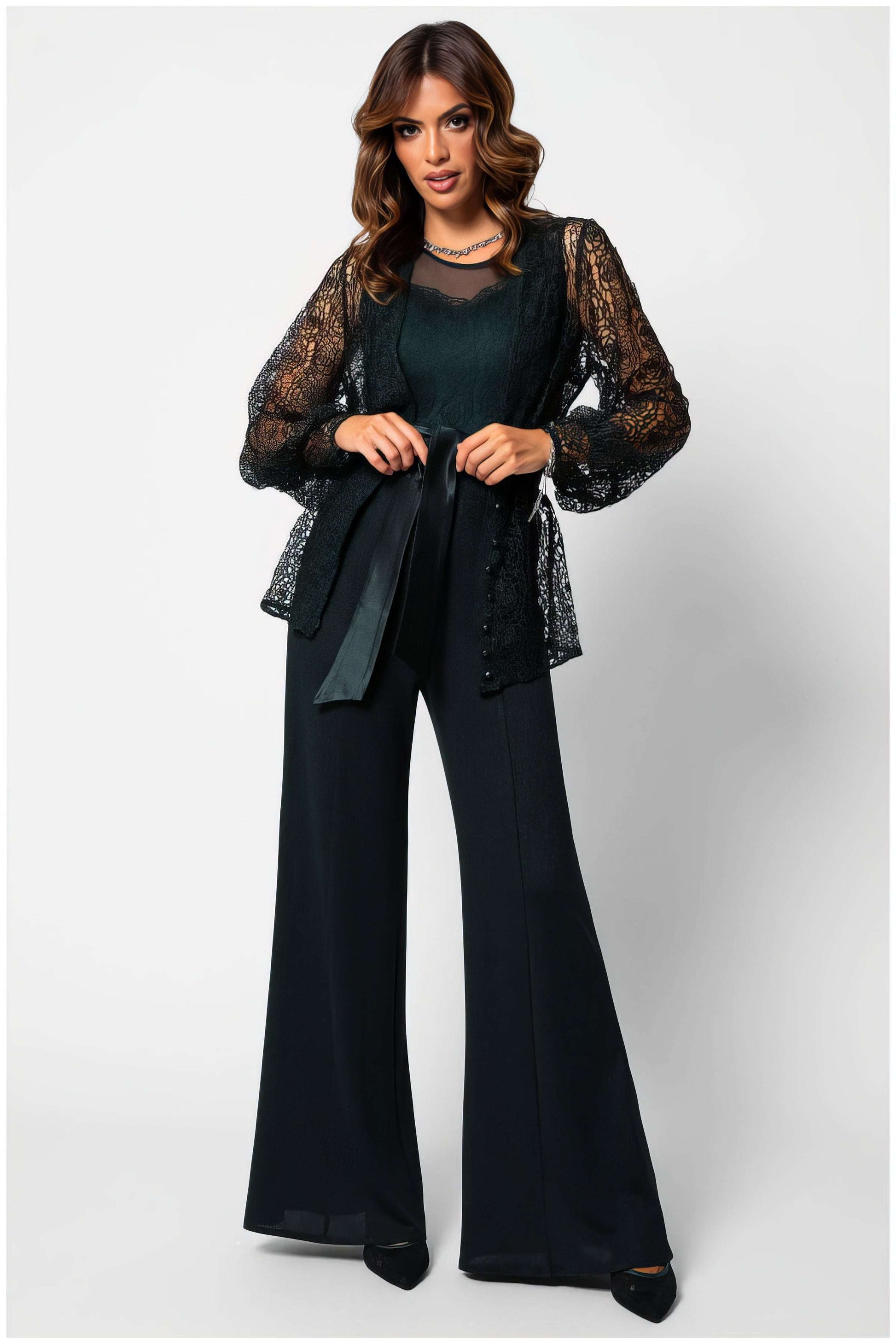 Woman wearing Jody Lace Belted Sweater in Midnight Green with wide-leg black pants, styled elegantly on white background