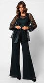 Woman wearing Midnight Green floral green lace cardigan Sweater Jody with semi-sheer sleeves and waist tie over black wide-leg trousers