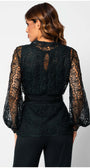 Woman wearing Jody Lace Belted Sweater in Midnight Green with intricate lace details and a belted waist, shown from the back.