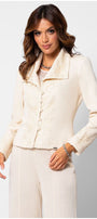 Woman wearing an ivory lace tailored blazer embroidered blazer with structured waist and matching tailored trousers against white background