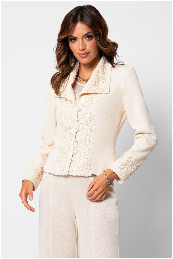 Woman wearing an ivory lace tailored blazer embroidered blazer with structured waist and matching tailored trousers against white background
