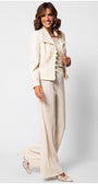 Woman wearing an ivory lace tailored blazer with embroidery details paired with matching wide-leg trousers and patterned heels