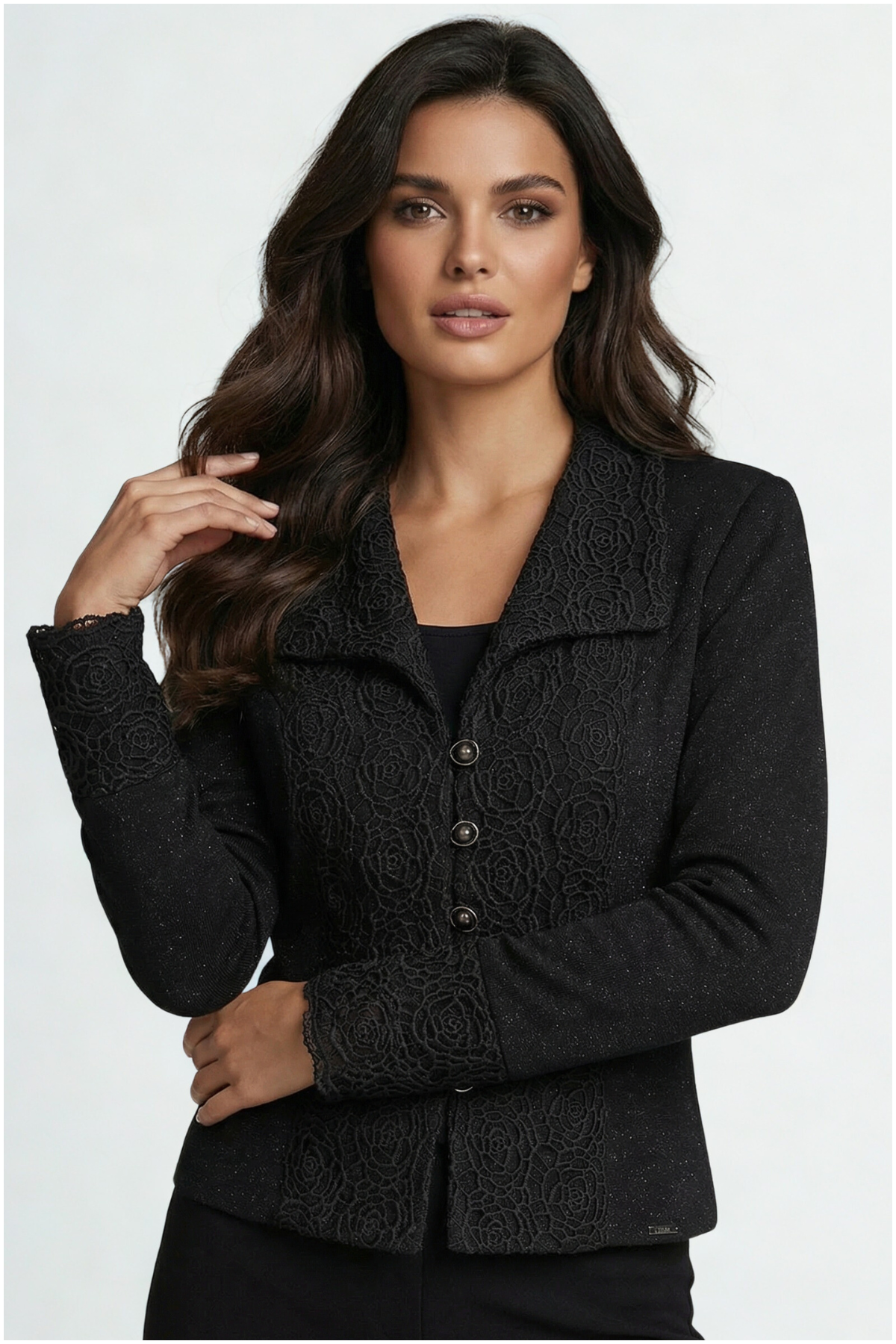 Woman wearing a black textured jacket on a white background