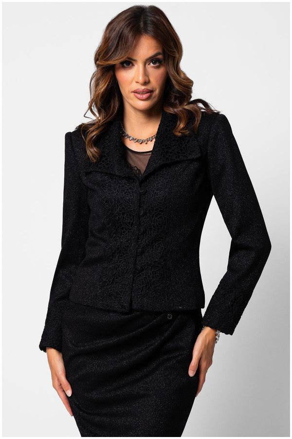 Woman wearing a black lace tailored blazer with intricate lace embroidery on collar and cuffs, styled for elegant wear