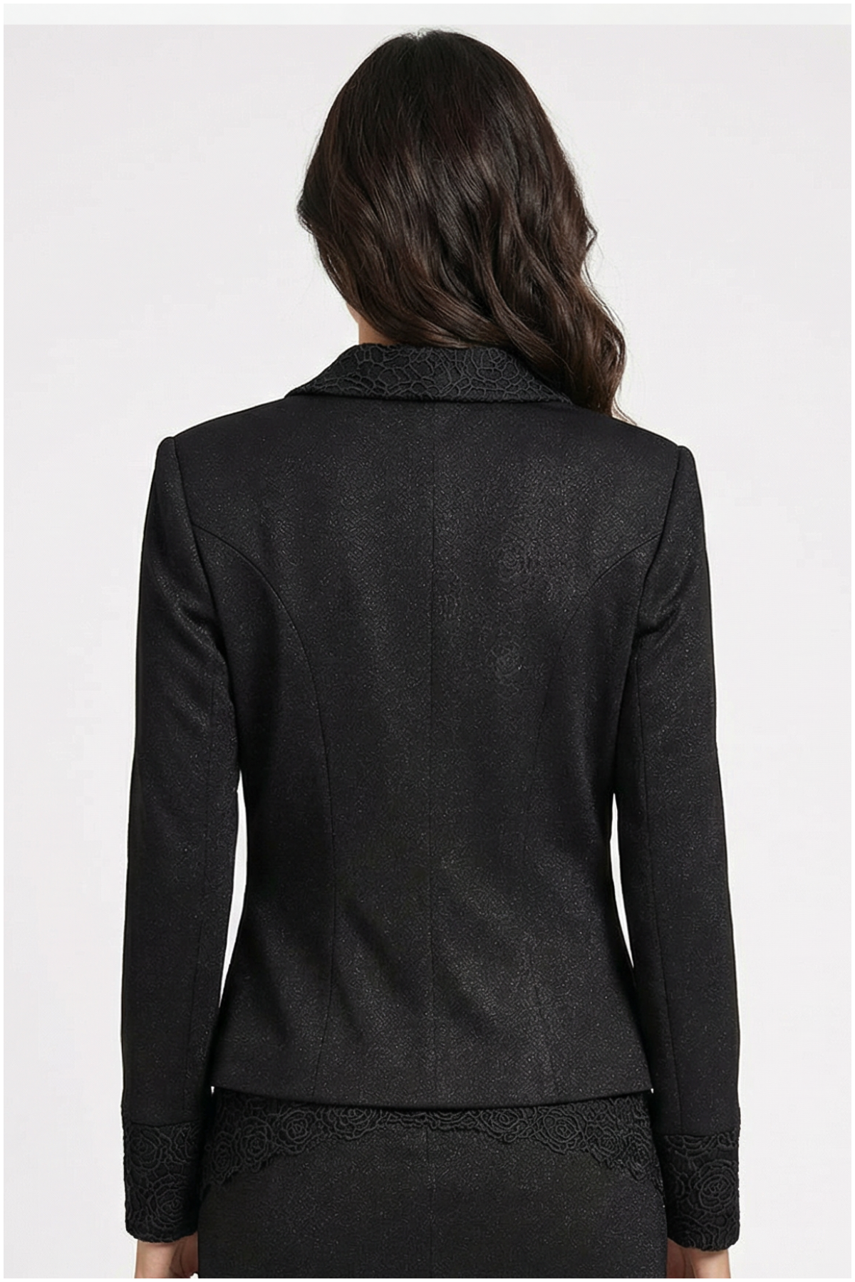 Black blazer worn by a person on a white background