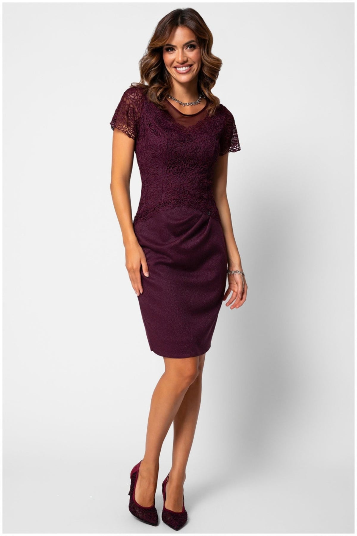 Burgundy Lace Cocktail Dress, Jody. Front view on the model, short lace sleeves and a draped skirt.