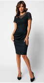 Woman wearing a fitted lace cocktail dress with short sleeves and tailored waist draping, styled for elegant occasions