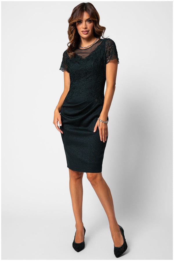 Woman wearing a fitted lace cocktail dress with short sleeves and tailored waist draping, styled for elegant occasions