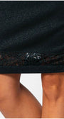 Close-up of Midnight Green Skirt Jody with lace hem detail highlighting elegant pencil silhouette.