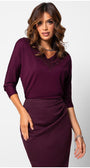 Woman wearing a bordeaux lace elegant blouse  Top Jody with lace neckline detail and three-quarter sleeves in a sophisticated styled pose