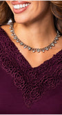 Close-up of neckline lace detail on Jody Elegant Lace Blouse in Bordeaux by Luna Fashion House with silver necklace