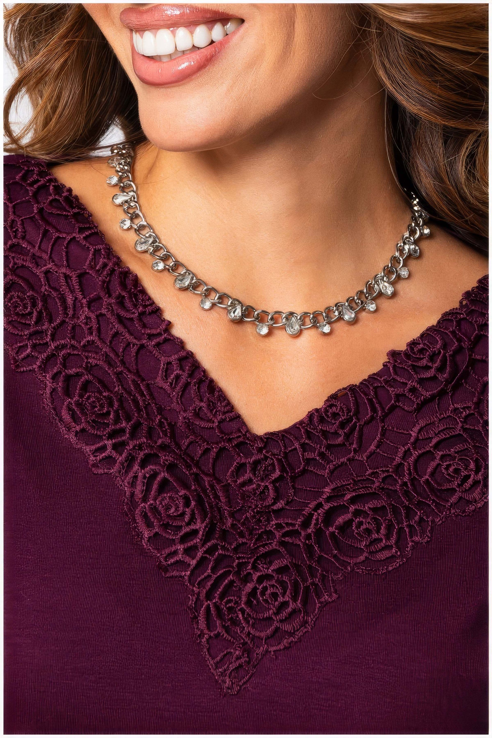 Close-up of neckline lace detail on Jody Elegant Lace Blouse in Bordeaux by Luna Fashion House with silver necklace