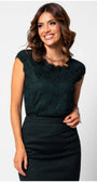 Woman wearing Jody Elegant Lace Blouse in Midnight Green with delicate floral lace pattern and short sleeves.
