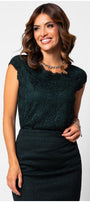 Woman wearinge legant blouse  a midnight green floral lace blouse with cap sleeves paired with a fitted dark skirt against a white background