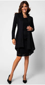 Woman wearing a black lace elegant blouse Jody styled with a matching skirt and flowing black blazer, smiling confidently.