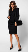 Woman in black dress holding a Jody black clutch bag with floral lace overlay and chain strap for evening wear
