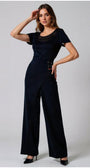 Woman wearing high-waisted Tailored Wide Leg Pants black wide-leg pants with wrap-effect waistband and lace-up detail, paired with a black top.