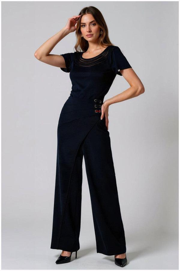 Woman wearing high-waisted Tailored Wide Leg Pants black wide-leg pants with wrap-effect waistband and lace-up detail, paired with a black top.