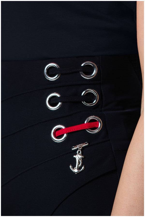 Close-up of silver eyelets and red lace detail with anchor charm on Greta Wide Leg Pants in Navy