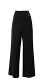 Greta Wide Leg Pants in Black with tailored wrap design and side lace detail for a refined, elegant look