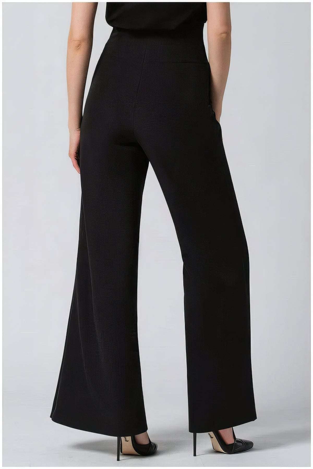 Rear view of Greta Wide Leg Pants in Black showcasing tailored fit and elegant wide legs for refined style
