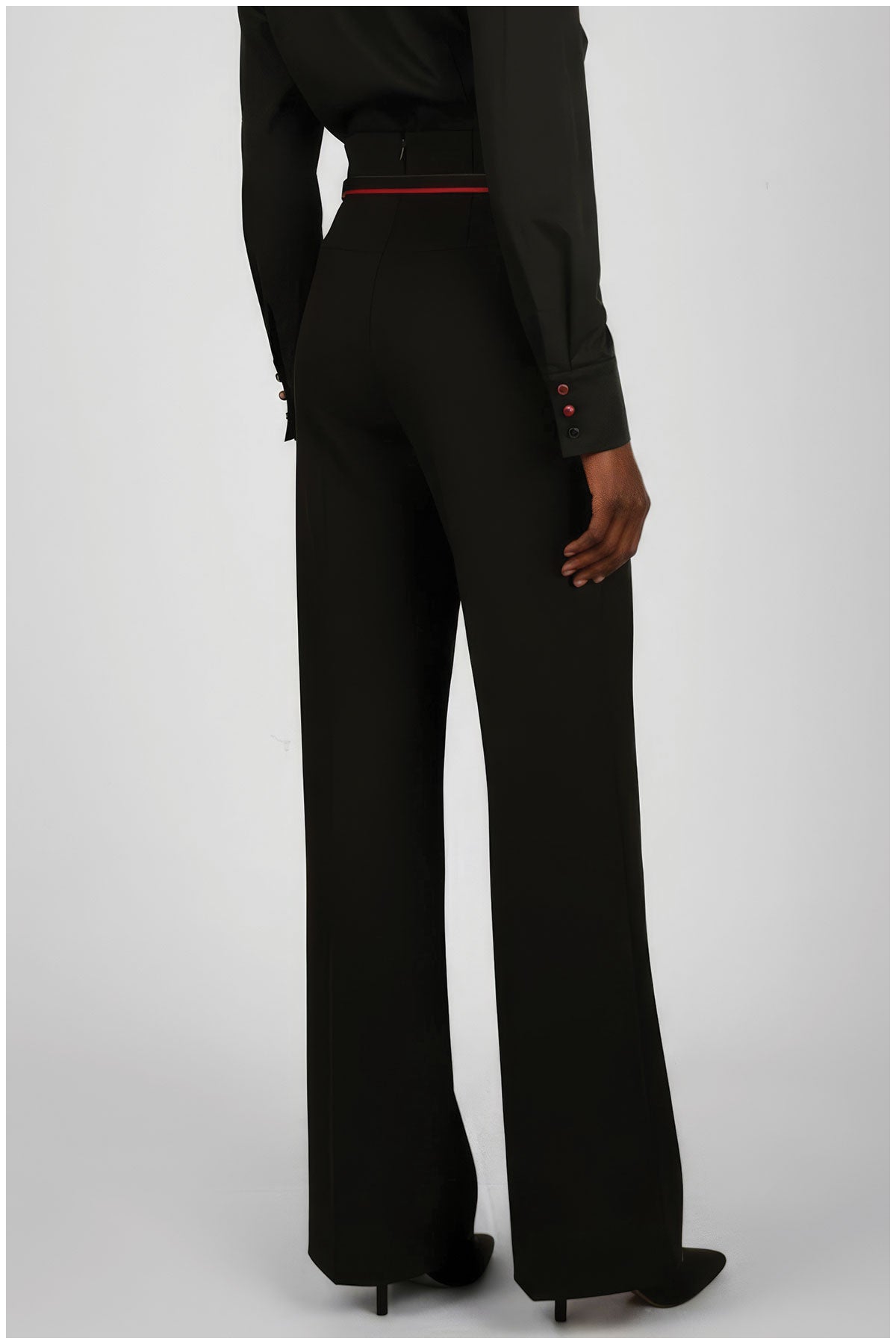 Black suit with a red belt on a white background