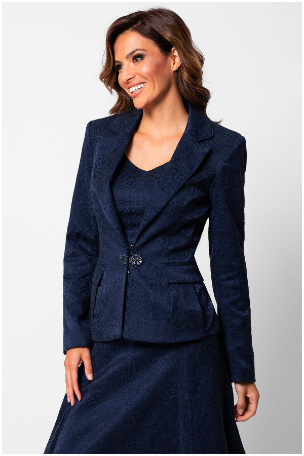 Woman wearing a navy blue suit on a white background