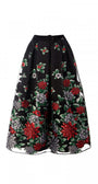 Black skirt with red and green floral embroidery on a white background Luna Fashion House