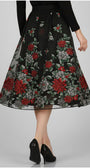 Floral embroidered skirt with red and green flowers on a plain background Luna Fashion House