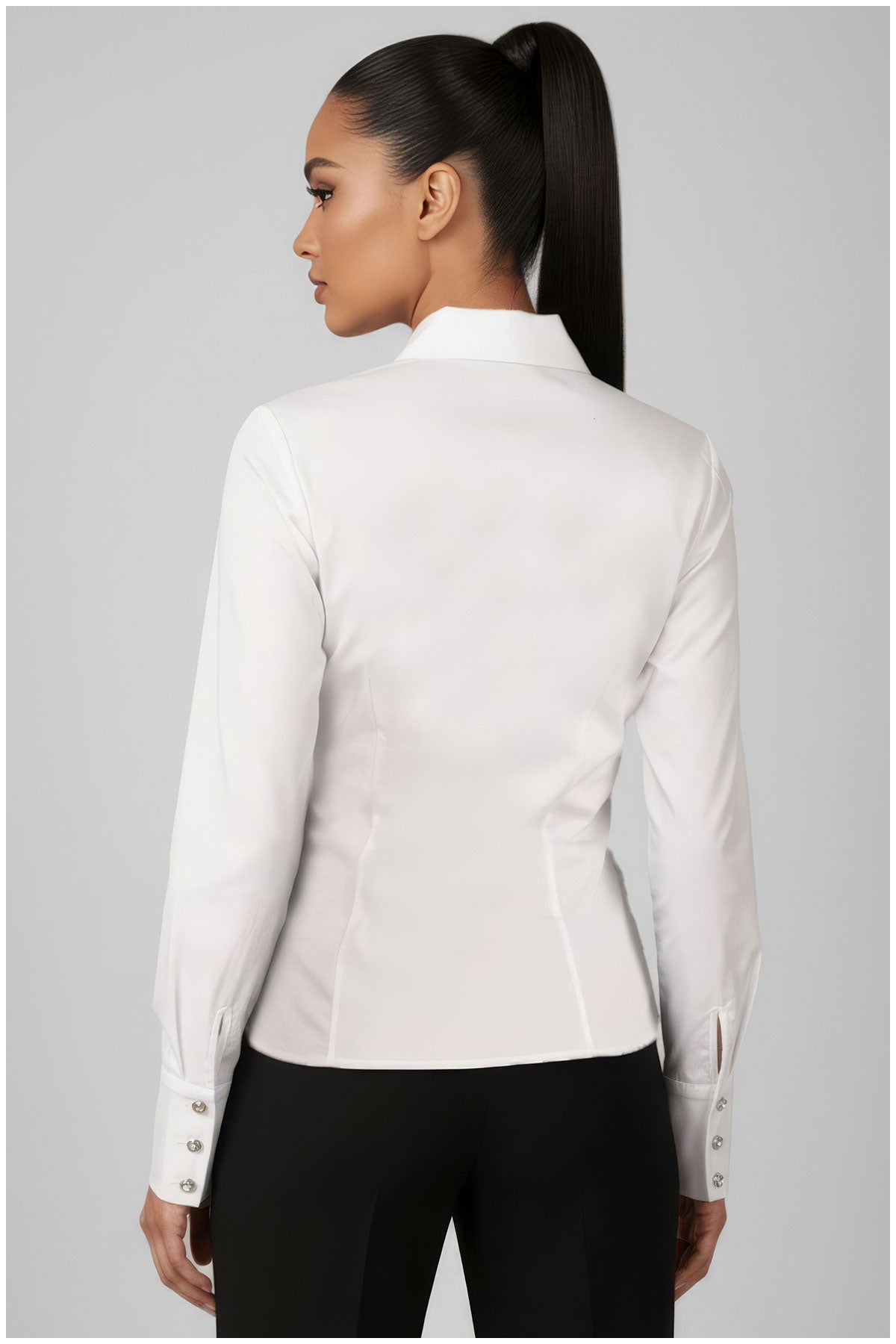 White blazer worn by a person on a gray background