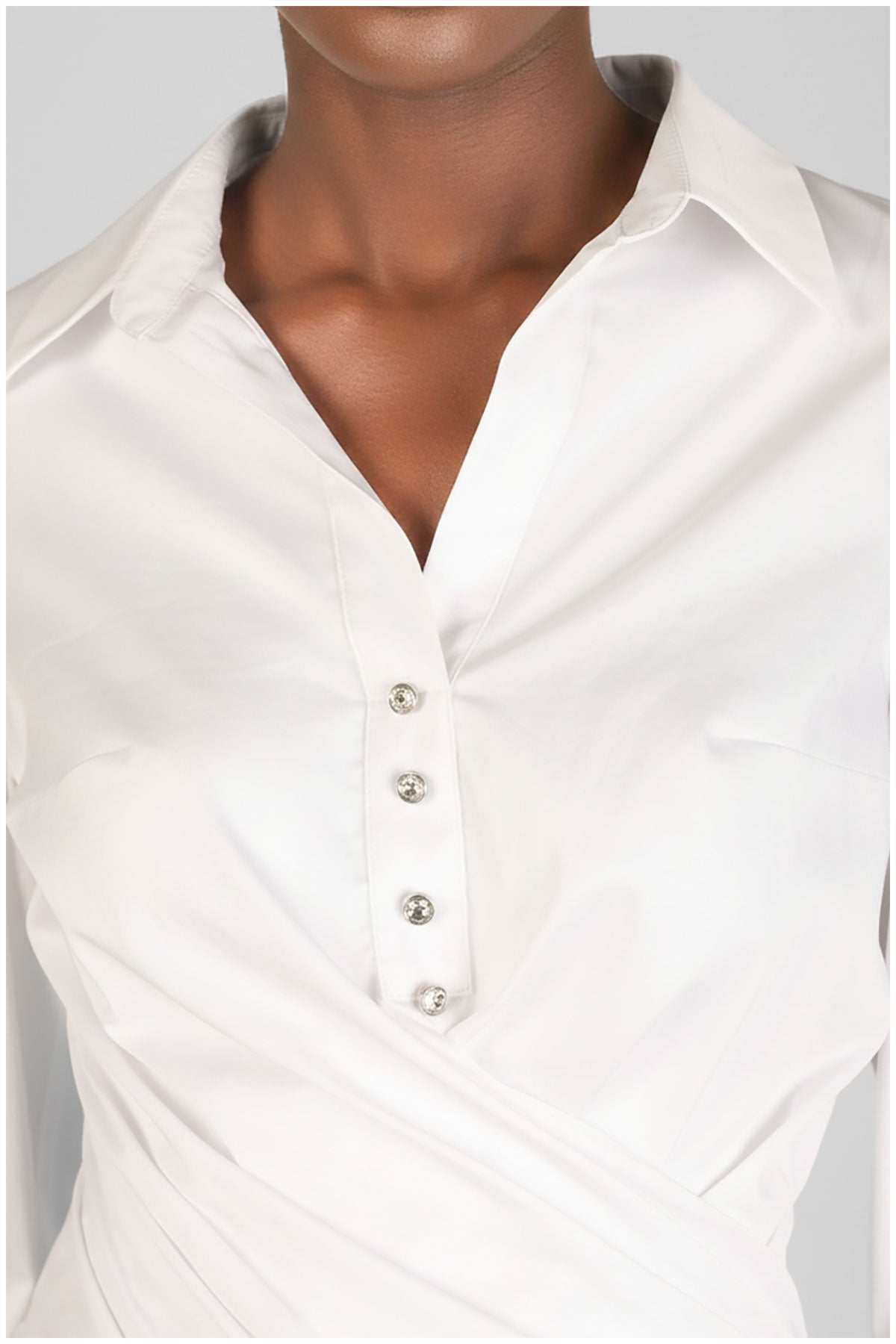 White blouse with buttons on a neutral background