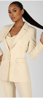 Woman wearing a beige suit with a plain background