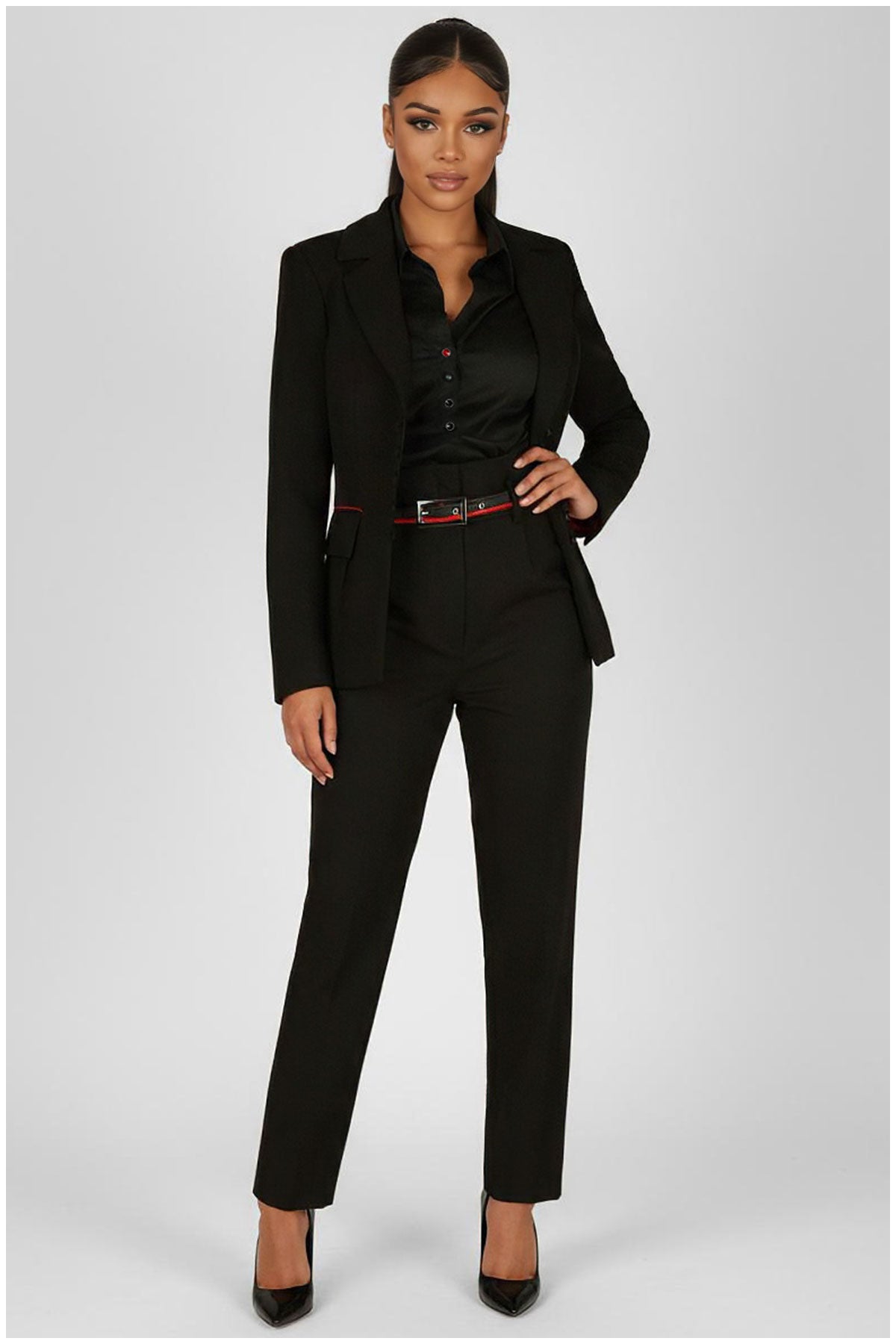 Woman wearing a black suit with a white background