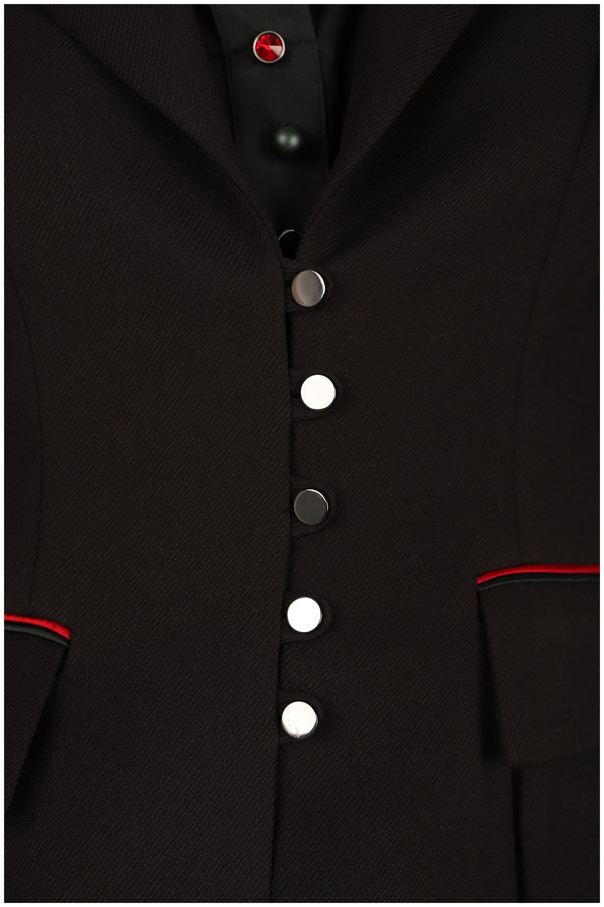 Close-up of a black coat with buttons and red accents on a white background
