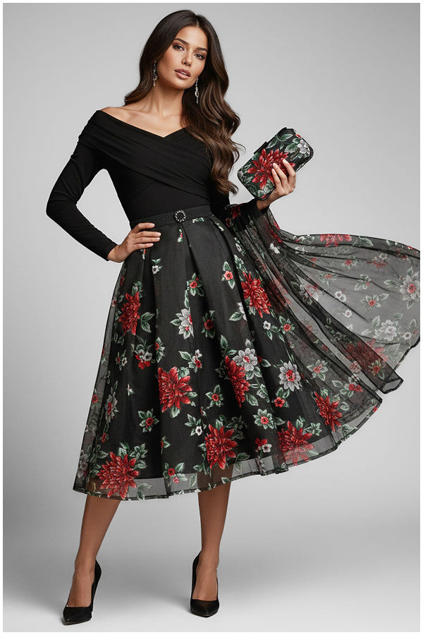 Woman wearing a black Luna Fashion House dress with floral pattern and holding a clutch.