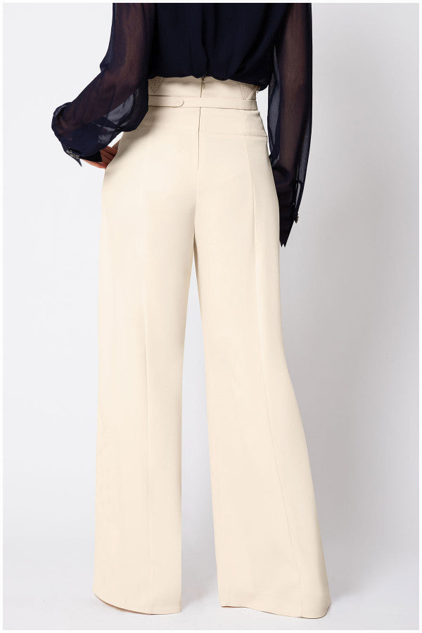 White wide-leg Luna Fashion House  pants worn with a black top on a white background